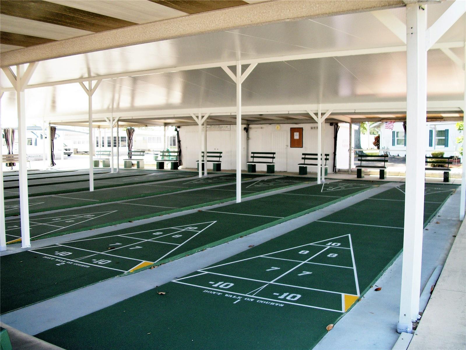 Covered shuffleboard courts to play in all types of weather.