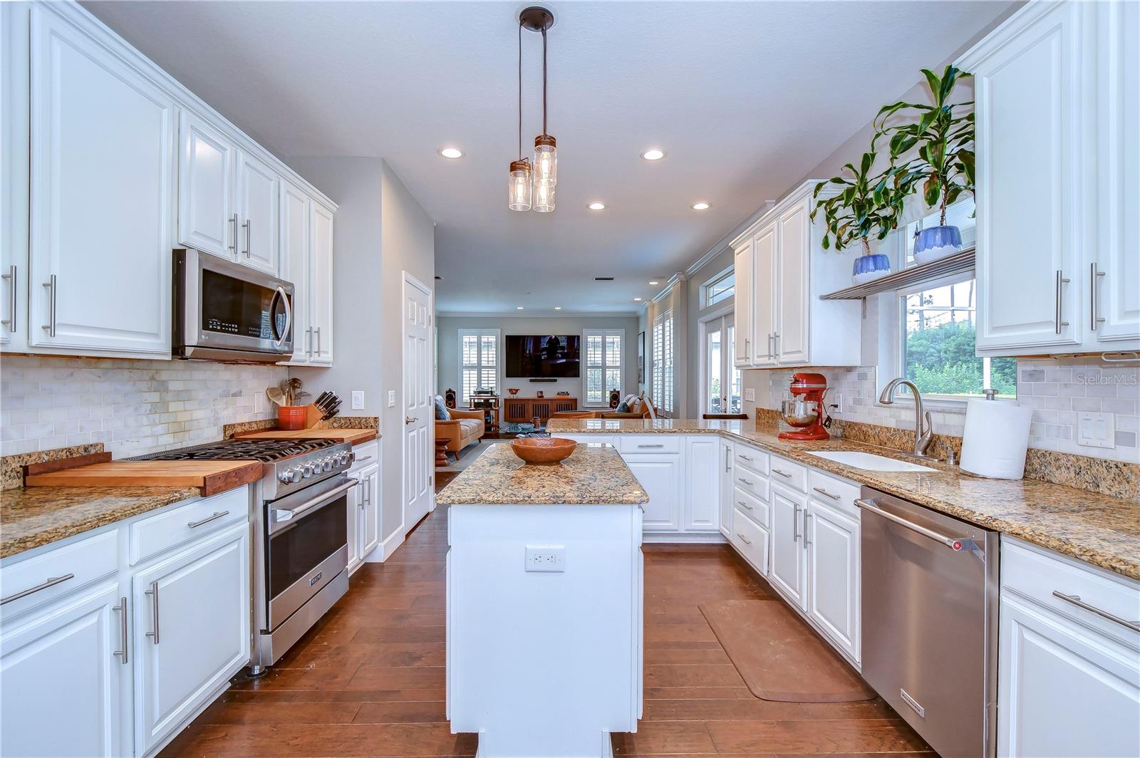 Stainless appliances including a 5-burner Viking stove and a spacious island!
