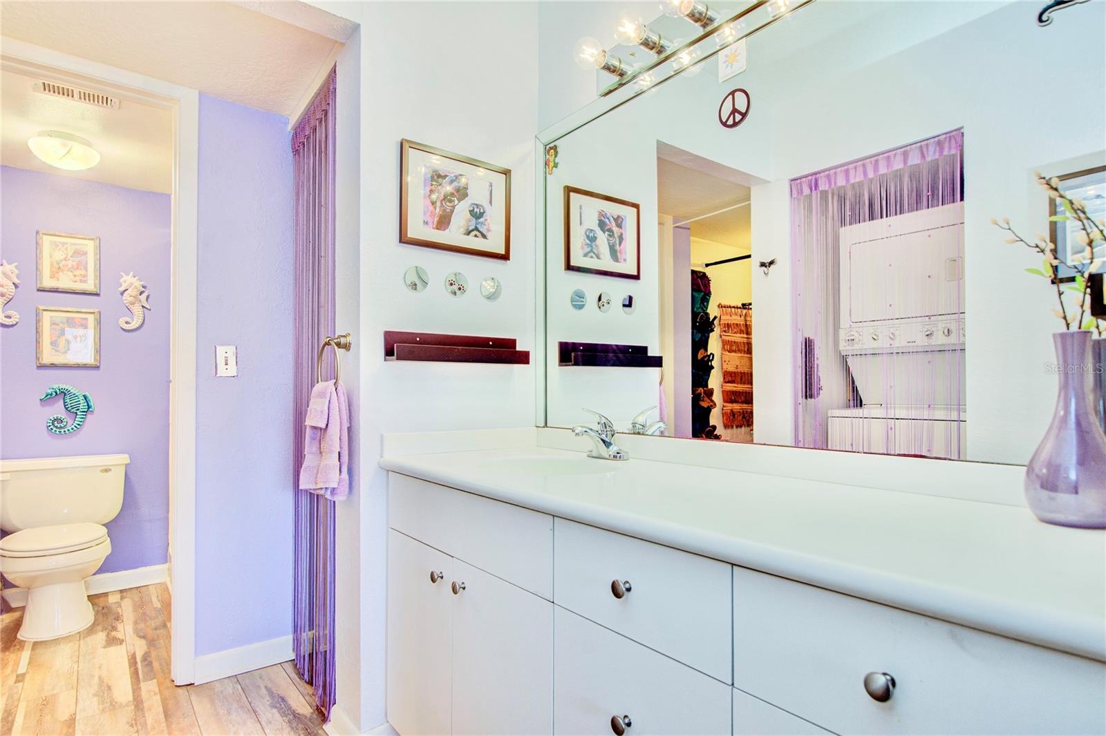 Primary Bathroom with separate commode / shower room, inside laundry, and 2 closets!