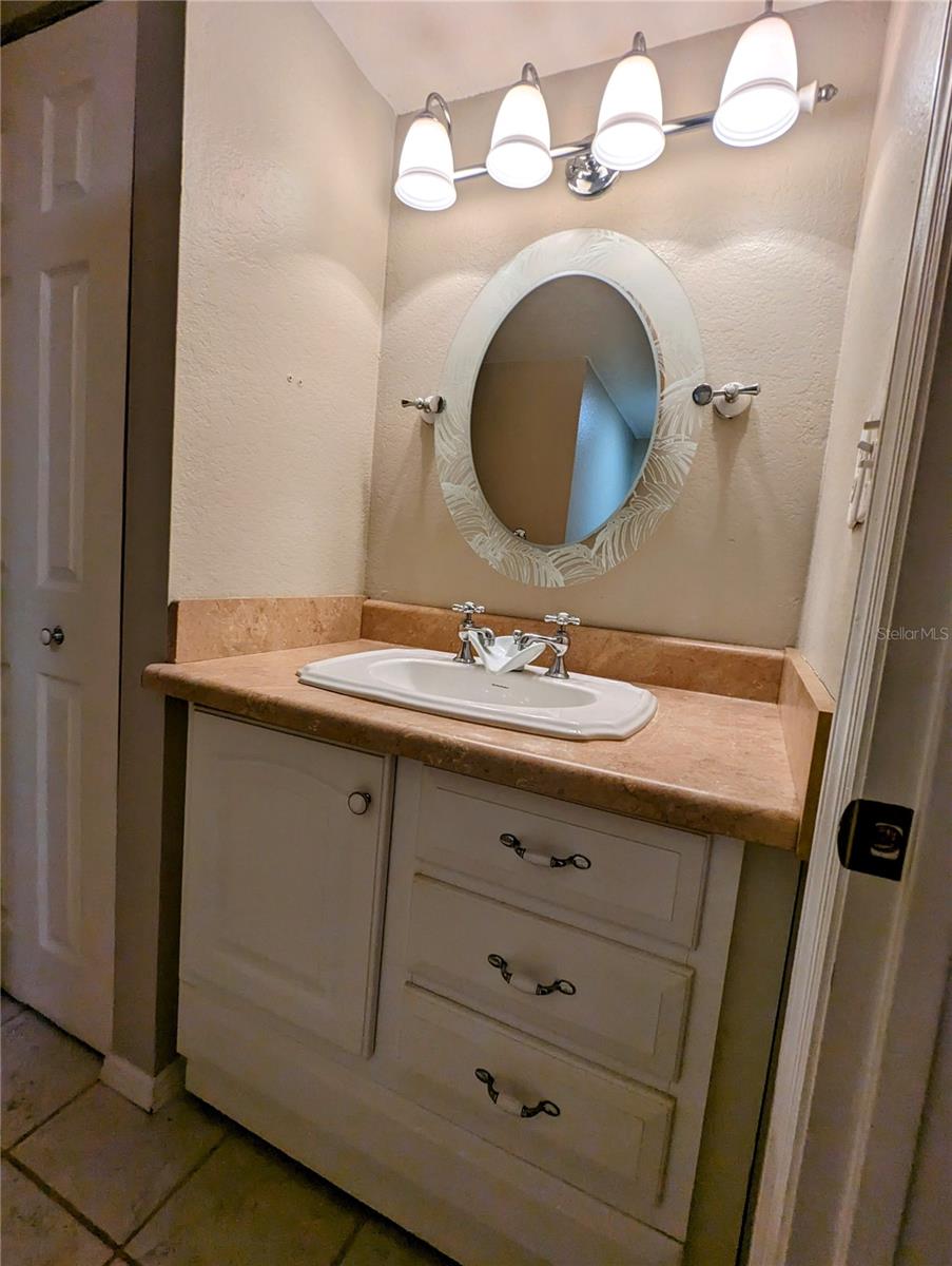 Half bath with Updated cabinets and Vanity area in the half bath