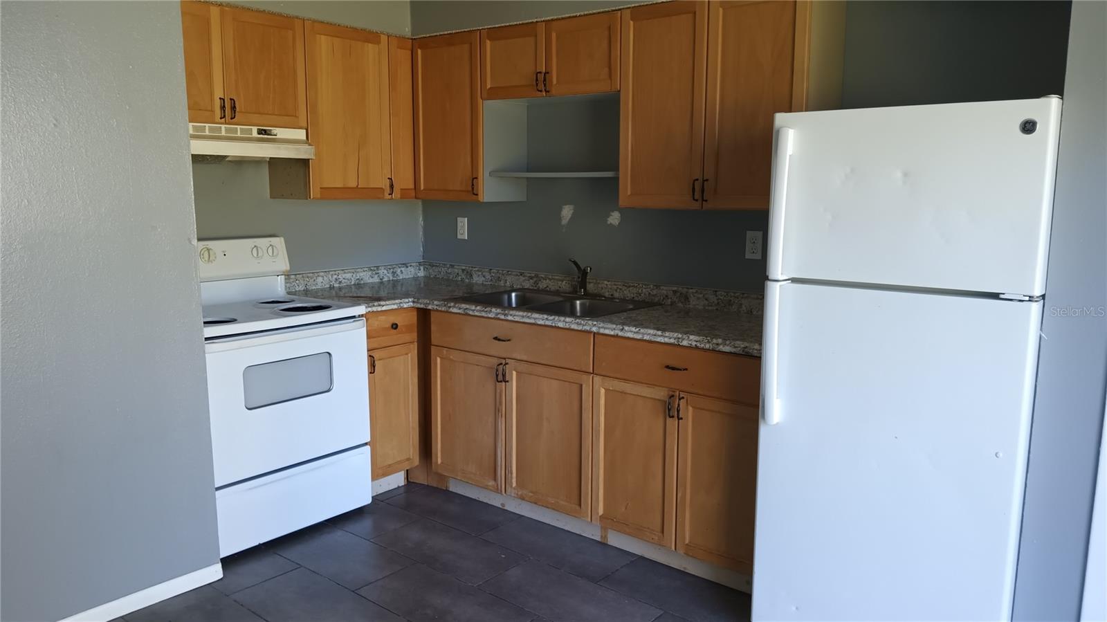 Washington St. Kitchen includes refrigerator and range