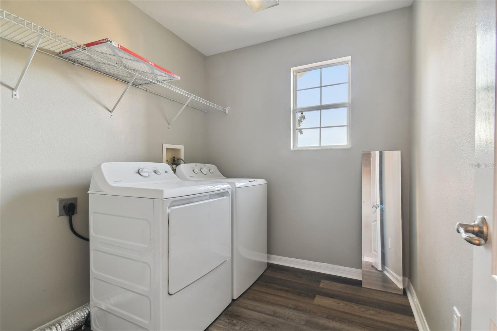 Large laundry closet with space for a potential sink area.