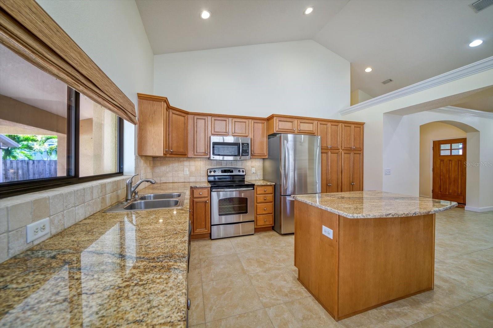 Vaulted Ceilings in Kitchen with Granite Countertops