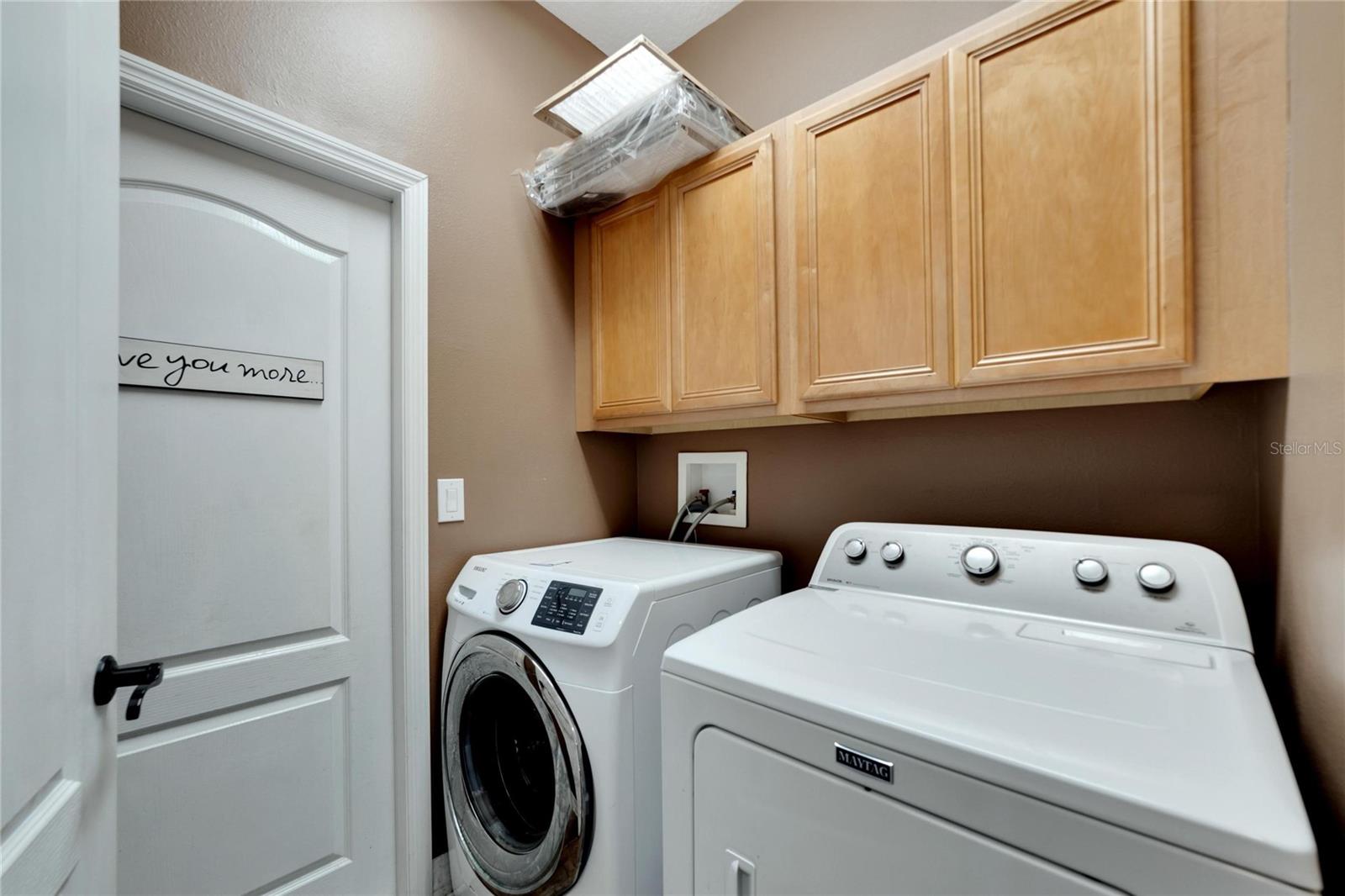 Laundry room with included appliances