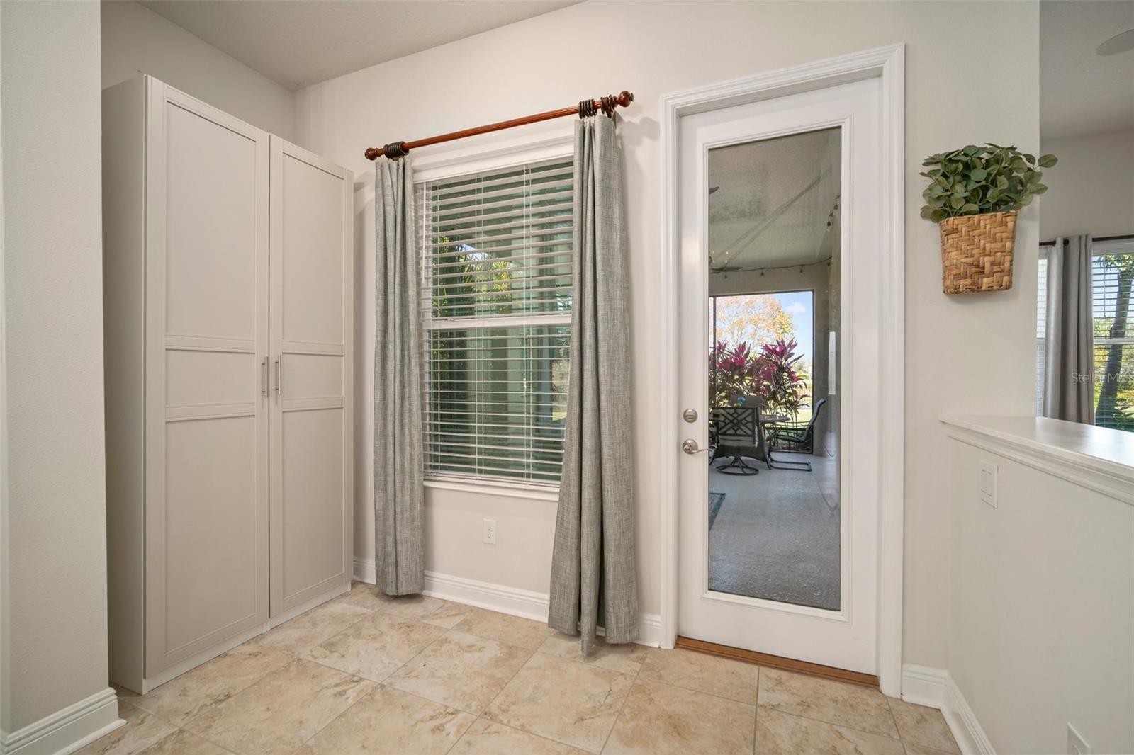 Patio door leading to covered screened lanai