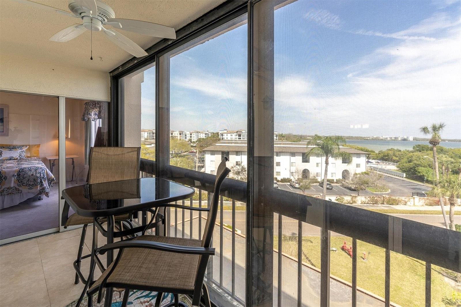 Balcony with view of Tampa Bay and showing entrance to primary bedroom