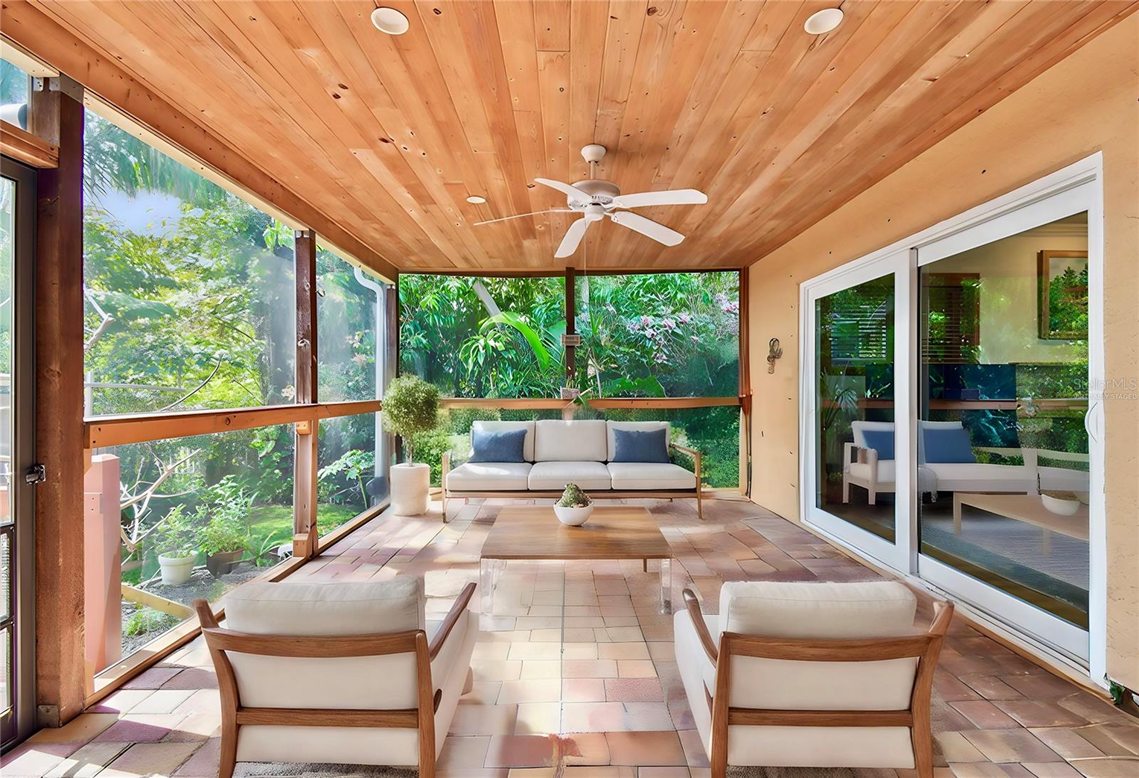 Virtually staged.. Large screened lanai with slider door access from living & family rooms