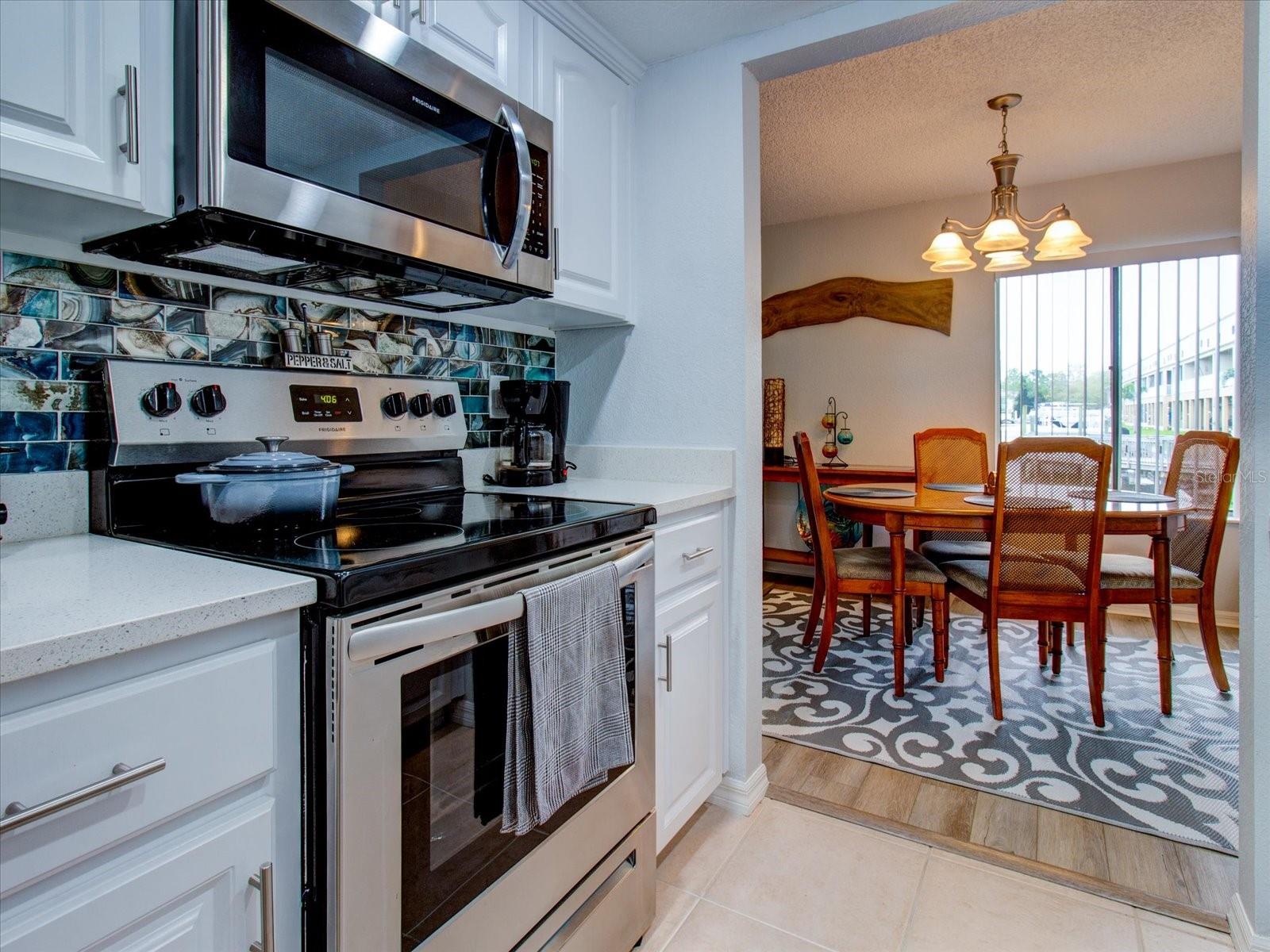 Updated Kitchen and Stainless Steel Appliances With View of Canal