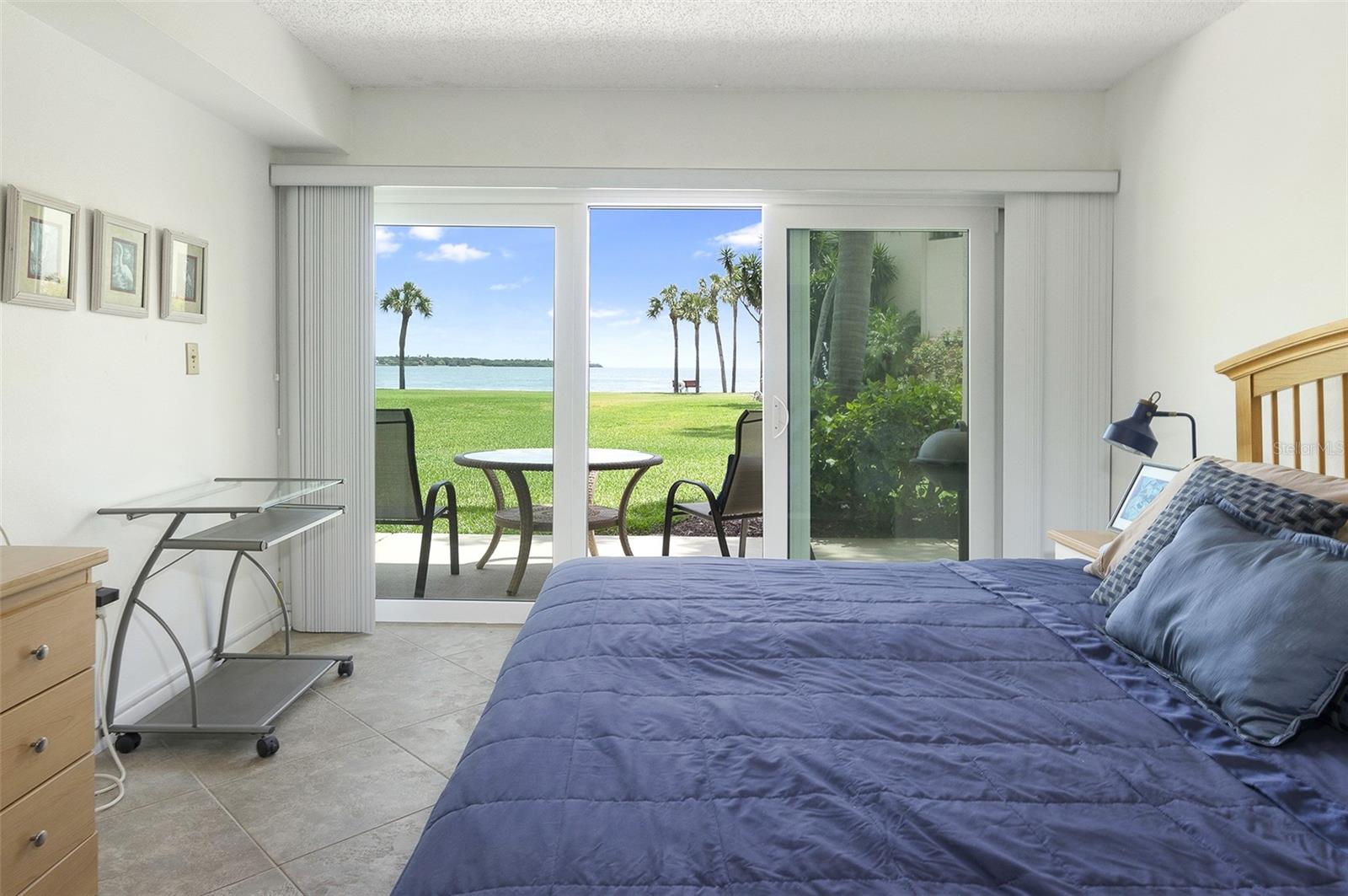 Bedroom, water and patio view