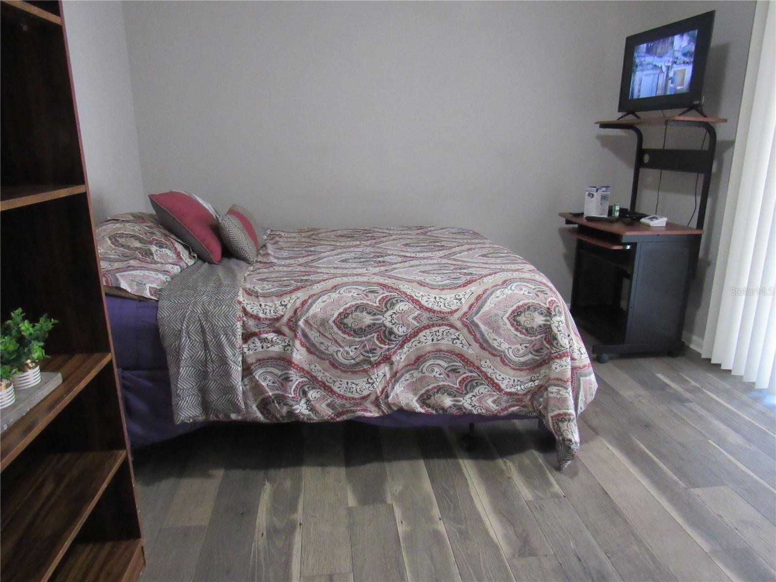2nd bedroom - luxury vinyl planks - access the bonus room