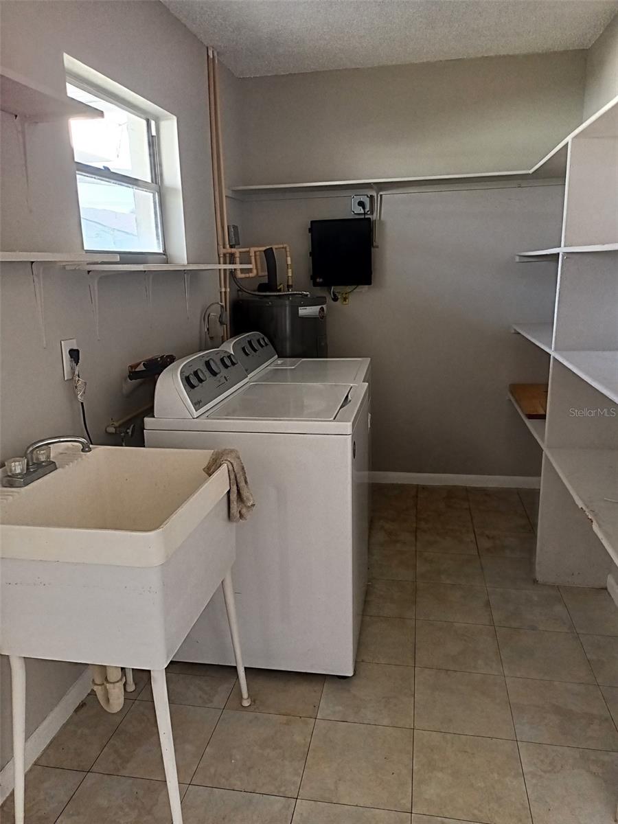 Utility Room - extra storage shelves - vented for heat and cooling