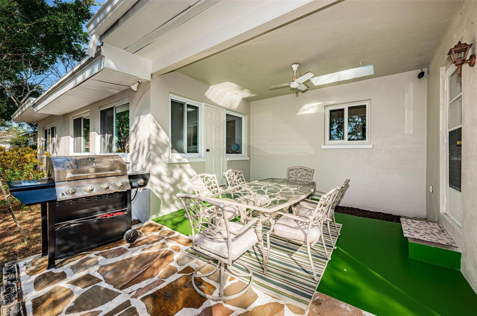 Covered back patio is easily screened with access from bonus room and dining room.