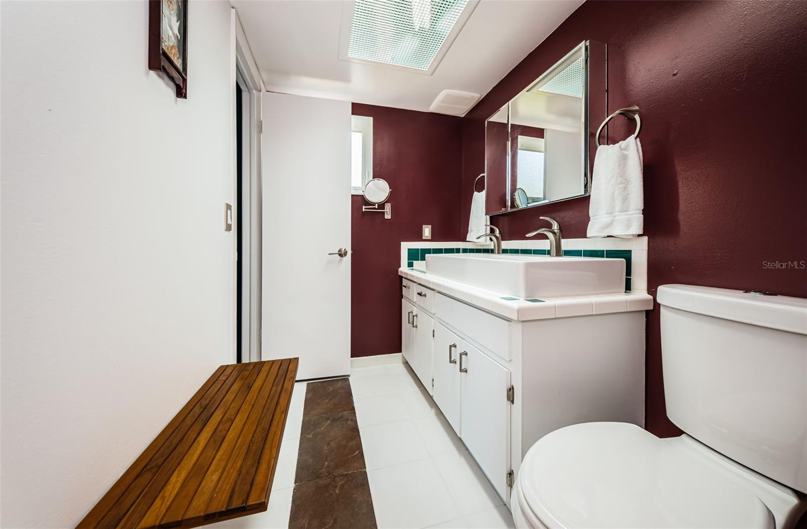 Owners Bathroom with adjustable teak bench