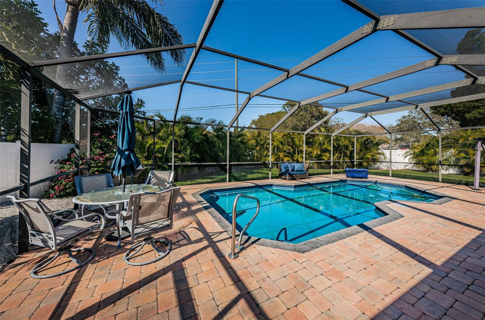 Entertain poolside with views of the yard