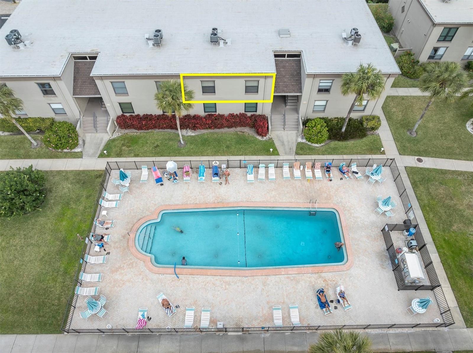 Aerial view of the pool and condo location