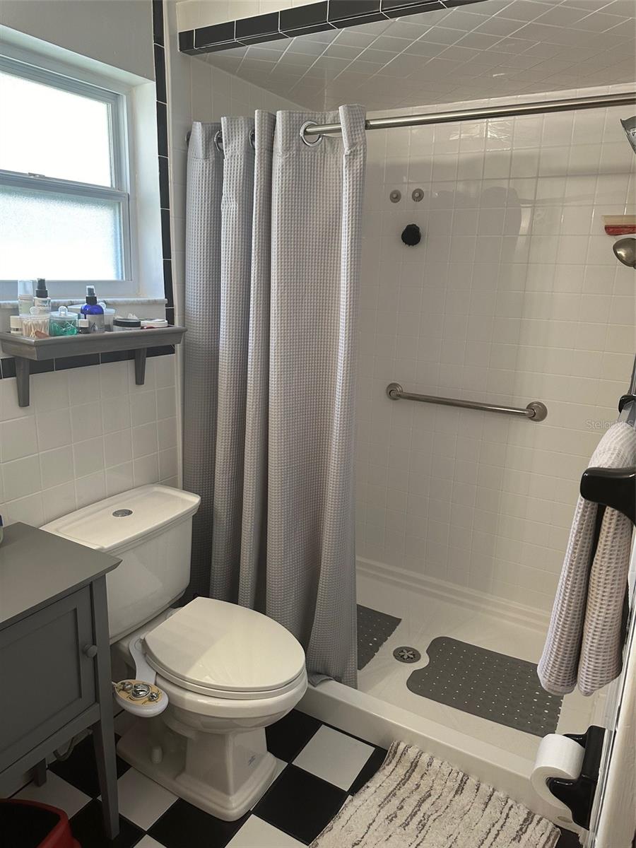 Primary bath with updated walk in shower