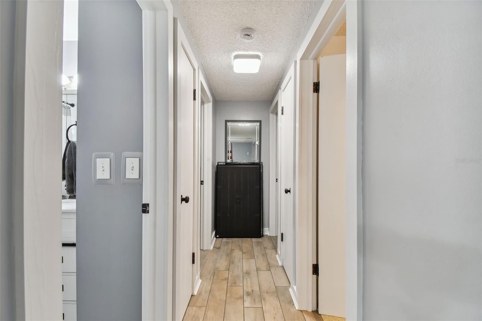 Hallway to the 2nd bath and 3 bedrooms.