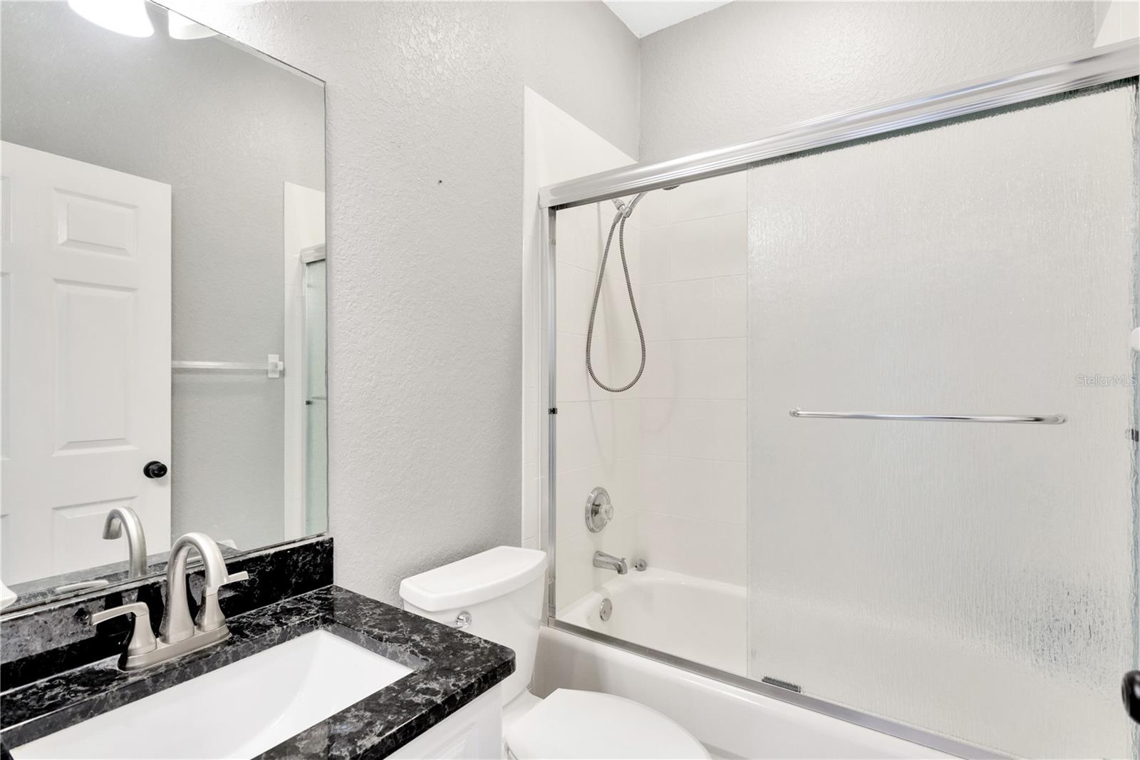 Main Bathroom w/Granite Vanity Sink and Tub/Shower Combo
