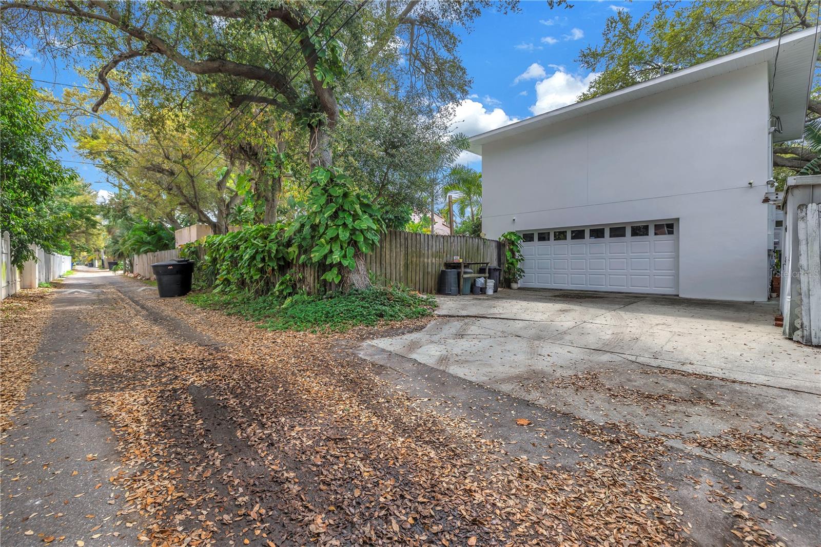 Alley access on the waterfront? This is very rare! 2 driveways on this amazing property.