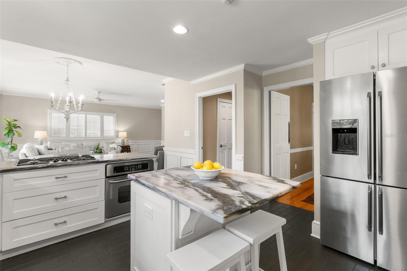 Kitchen includes island, stainless steel appliances, gas stove, and plenty of storage