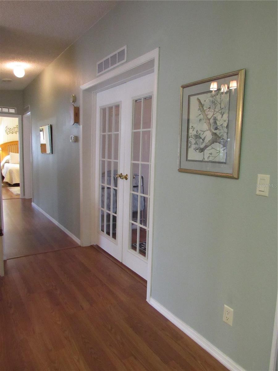 Hallway & office/den with French doors.