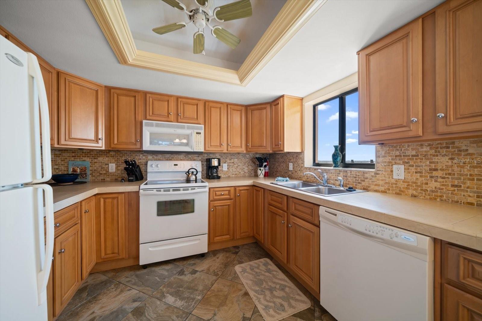 Kitchen has solid wood cabinets and is a delight for gourmet cooks.