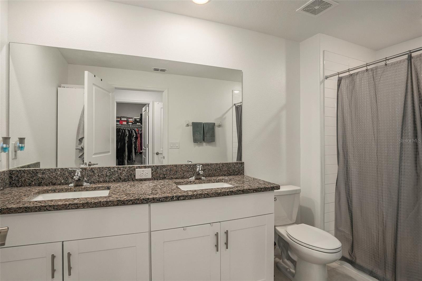 En Suite Primary Bathroom with Dual Sinks, Granite Countertops