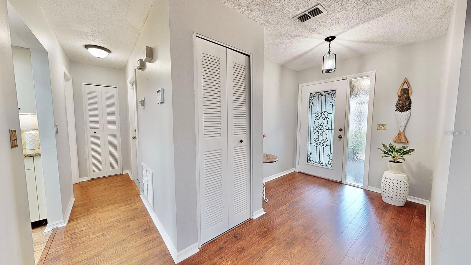 Foyer and hallway to kitchen, laundry and garage