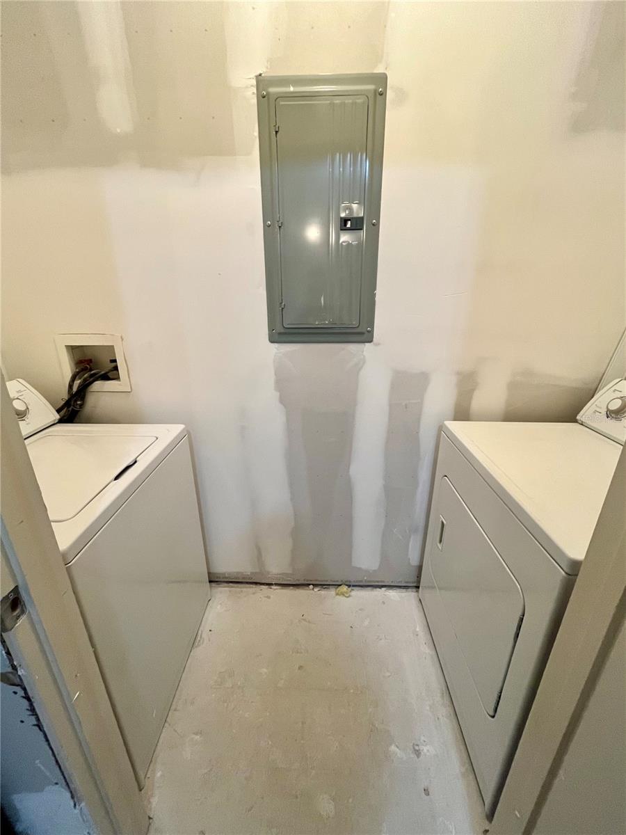 Conveniently located Laundry Room off the Kitchen