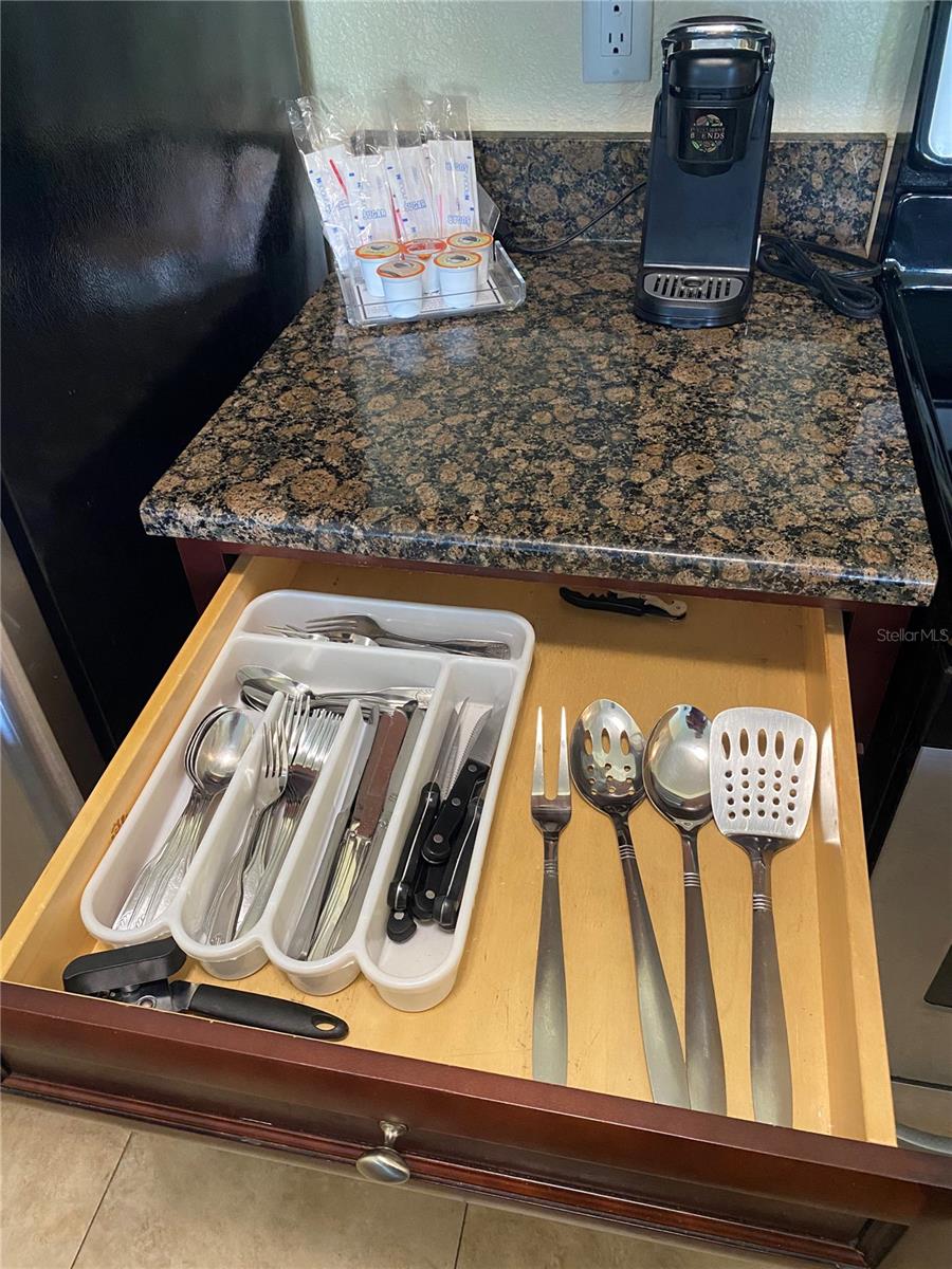 The kitchen is stocked with cutlery.