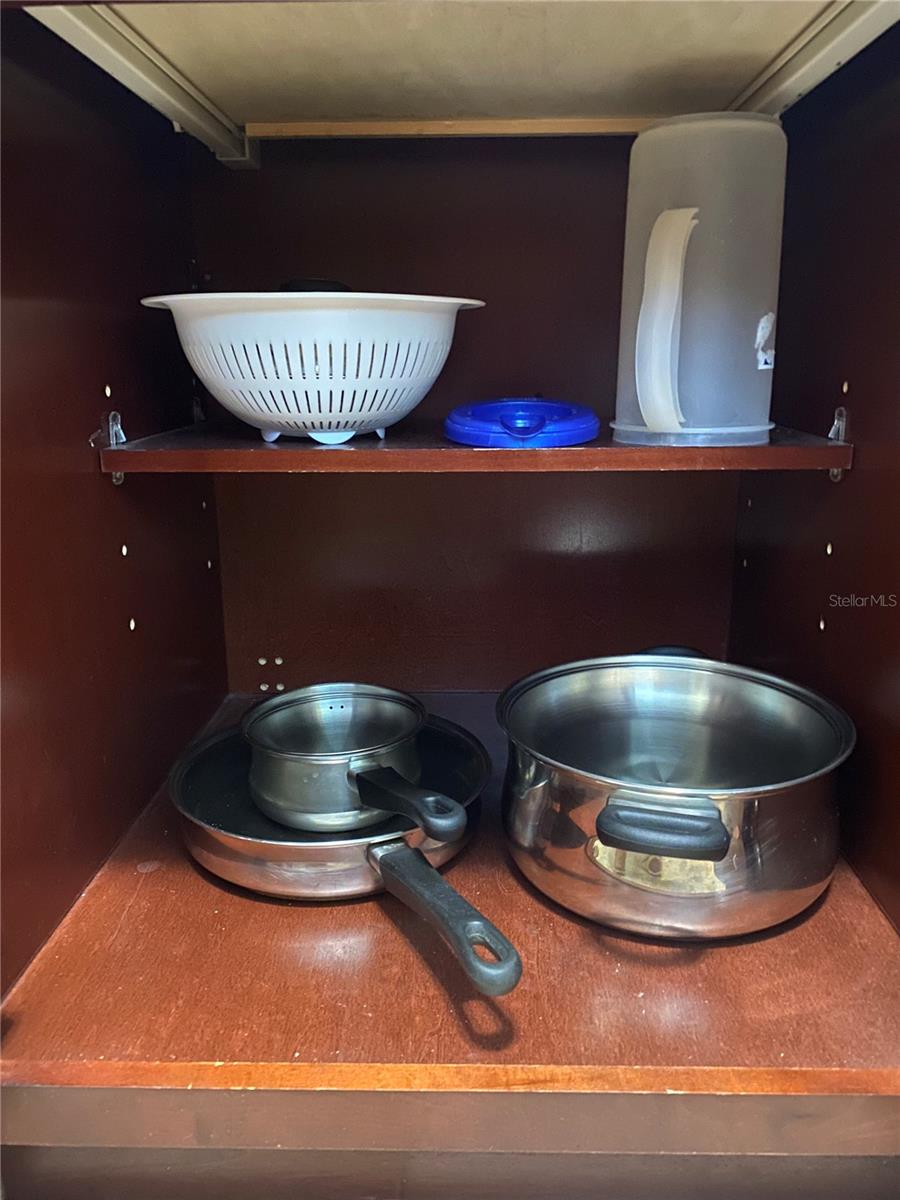 The kitchen comes with pots and pans.