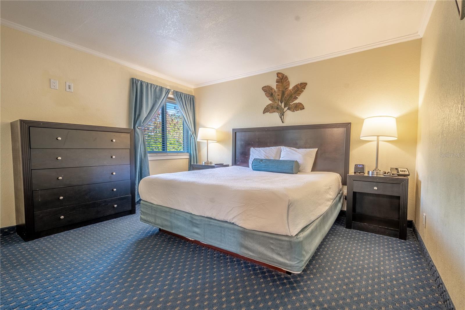 Primary bedroom is fully furnished including a king size bed.