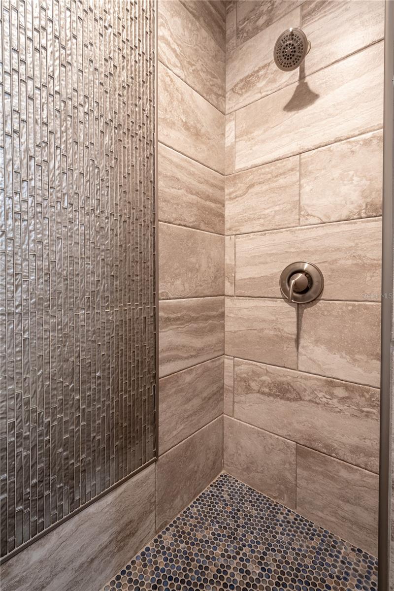 The first floor primary bath features a walk-in shower.
