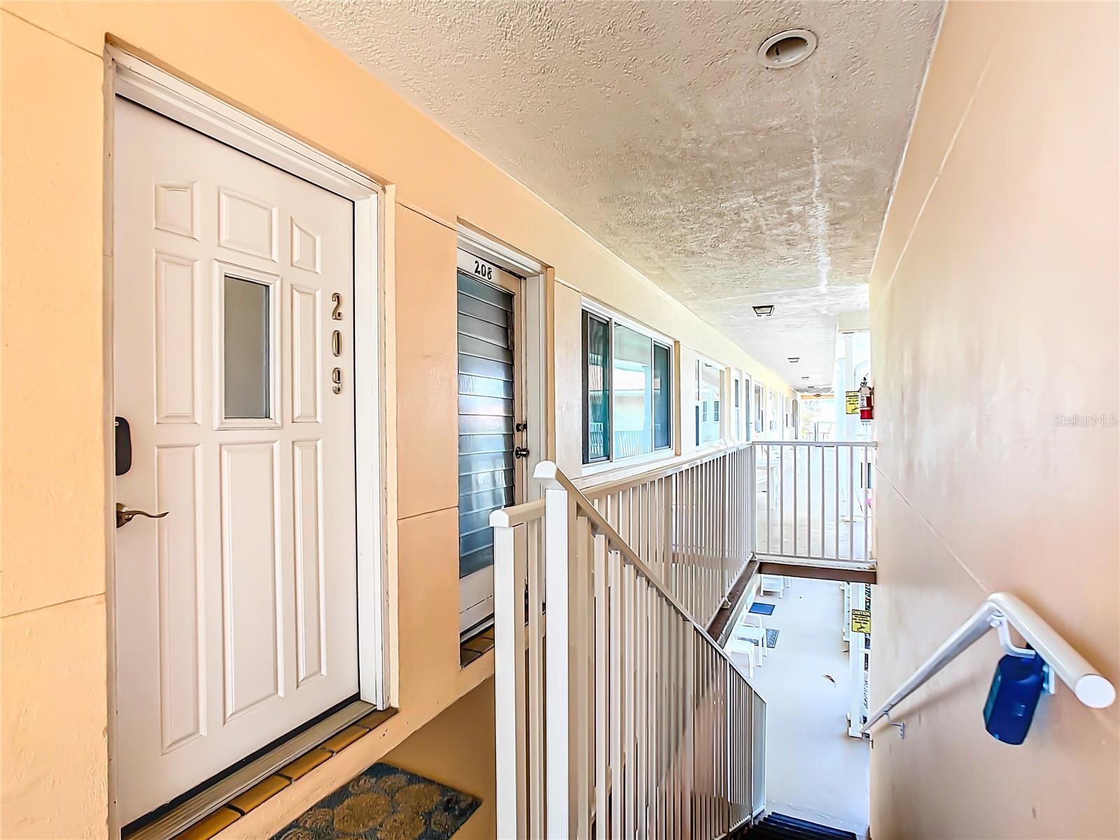 Unit 209 at 7740 Boca Ciega Dr- Once you get to the top of the stairs, the unit is immediately there.