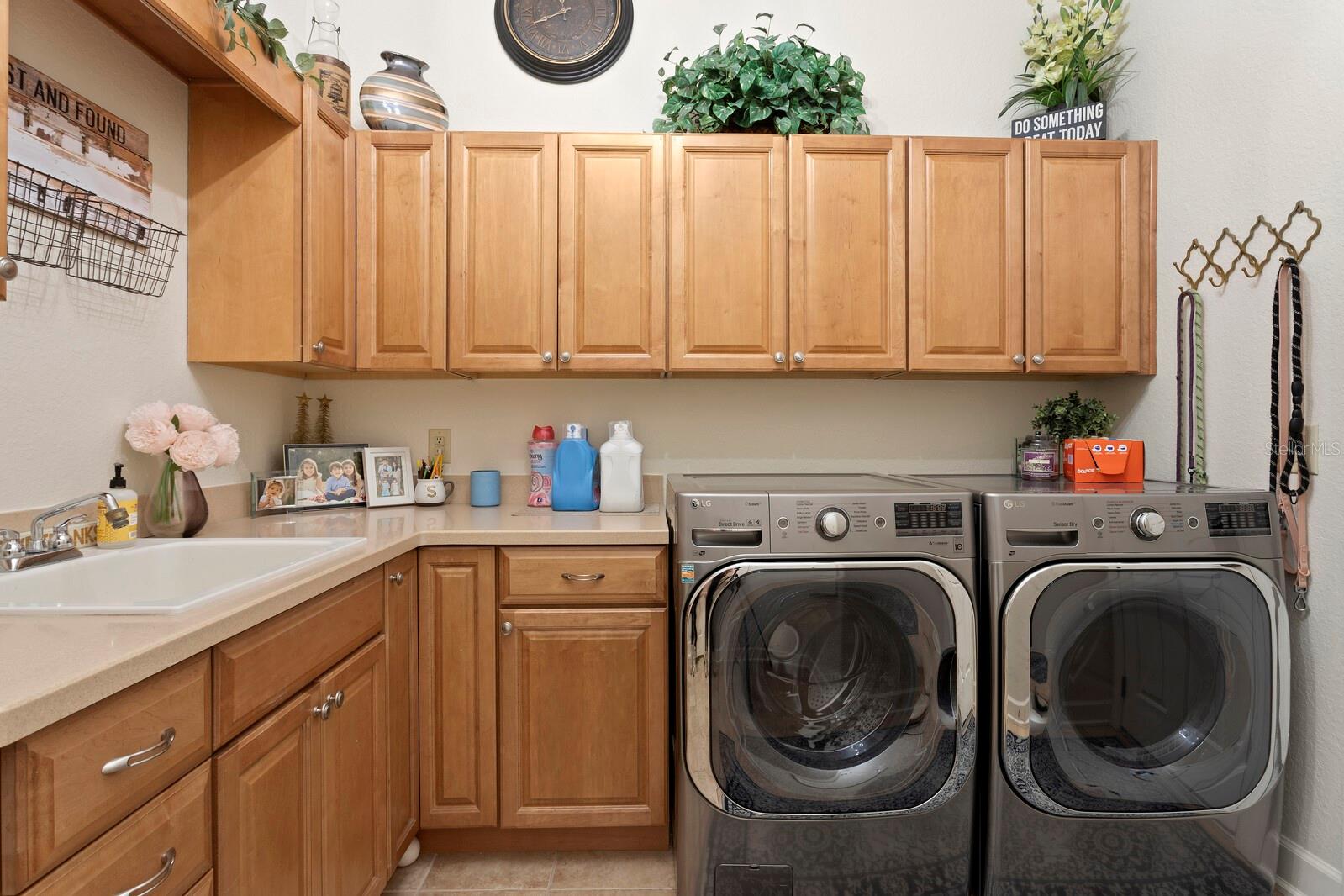 Laundry room with sink and tons of cabinet space!