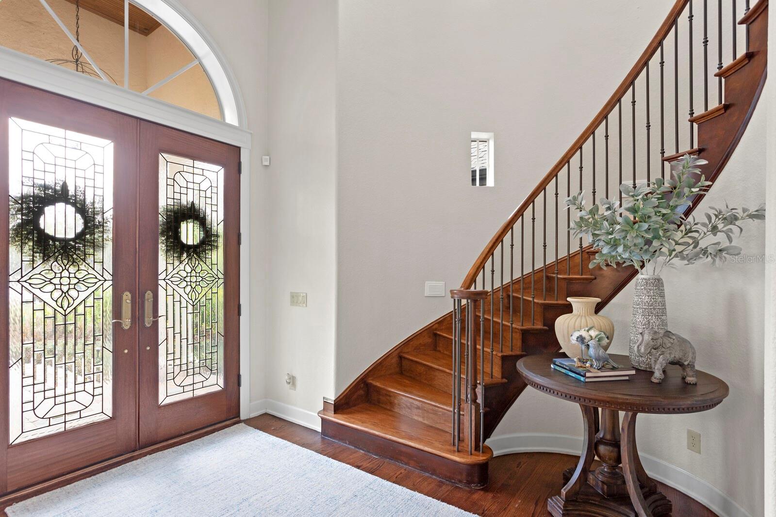 Grand foyer with custom-leaded glass doors!