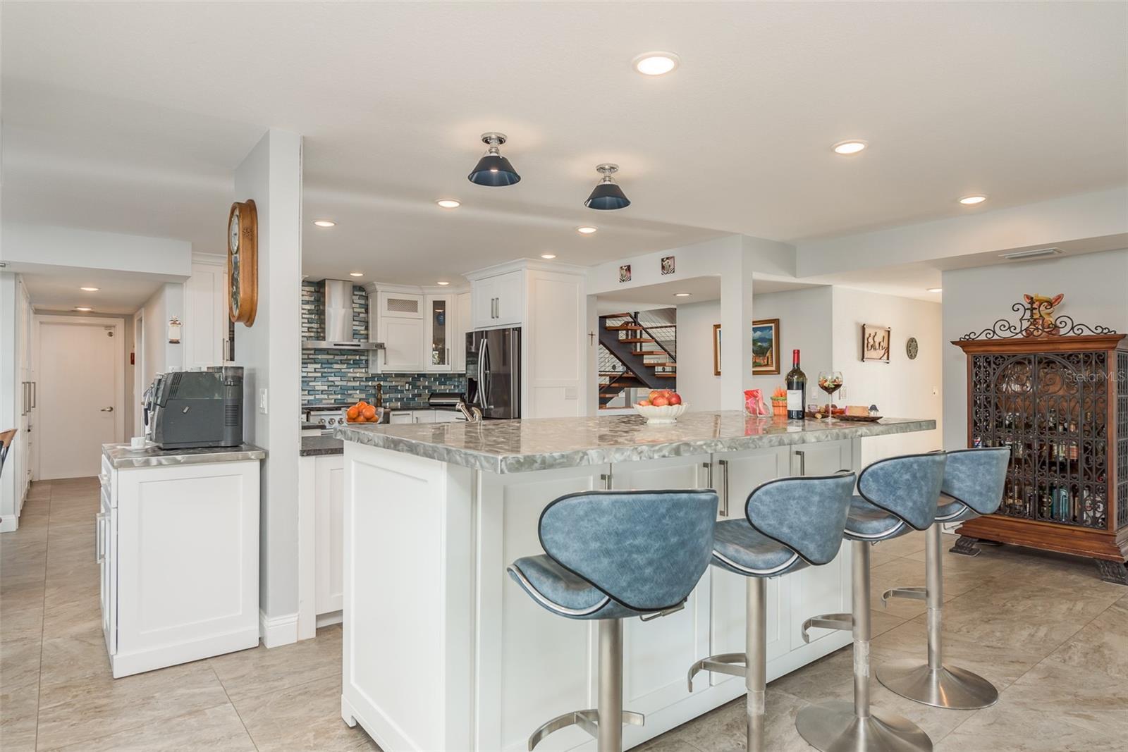 Kitchen features ample storage and is open to family room