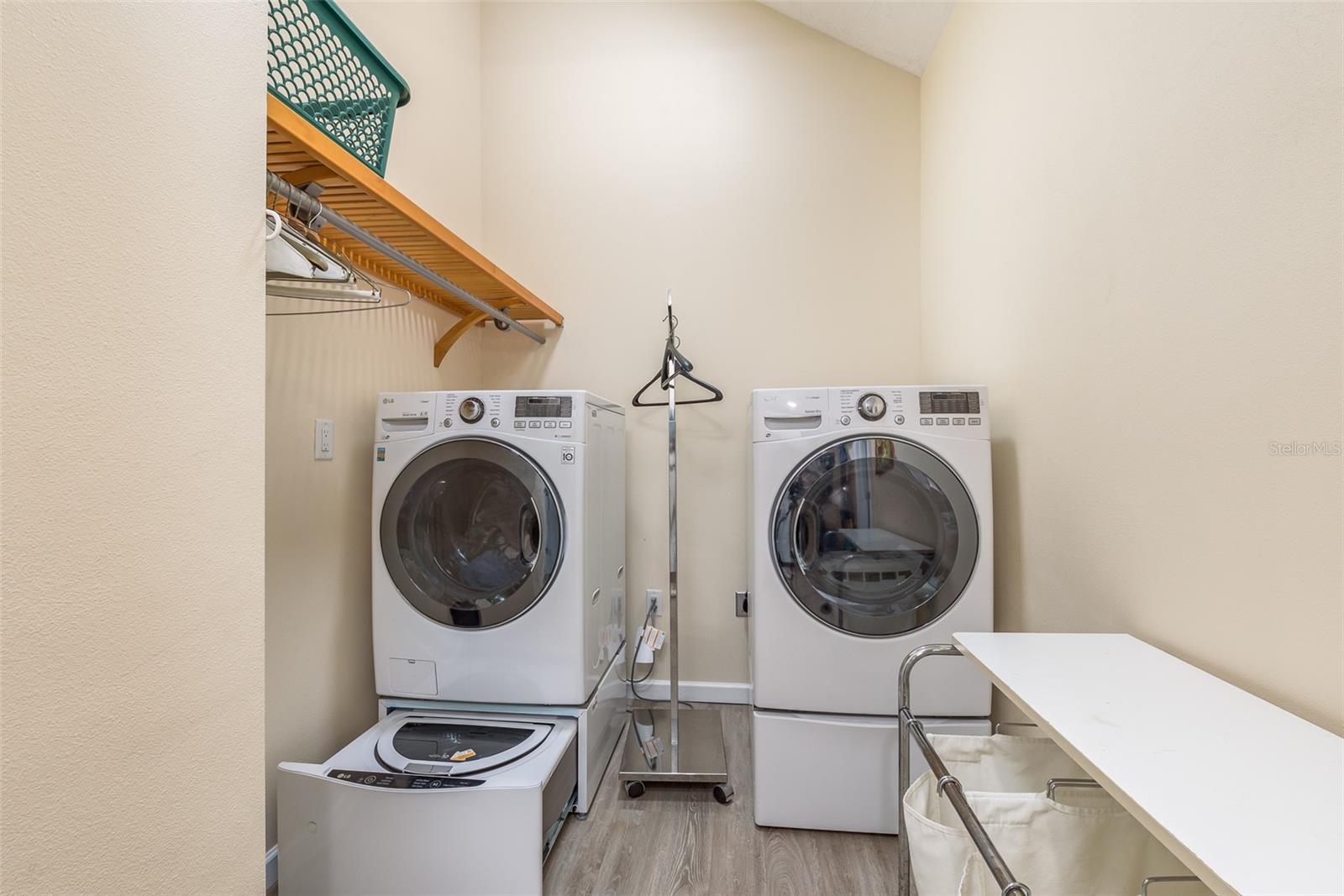 Upper level laundry room with 2 Washers and 1 dryer