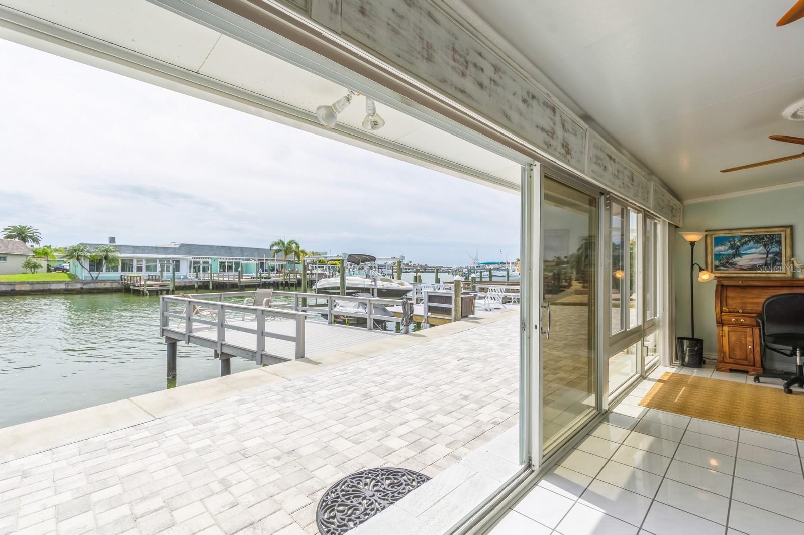 Sliding doors open up to your back yard patio and dock