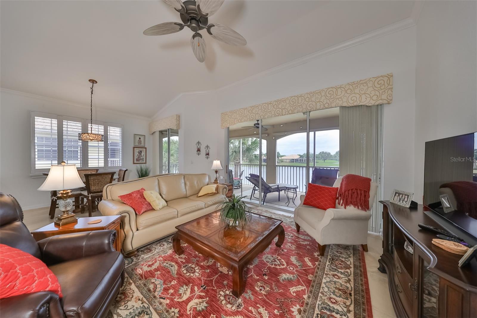 Living Room has vast water/golf course views, with lots of natural light making this space feel open and unencumbered, while also being relaxes and tranquil.