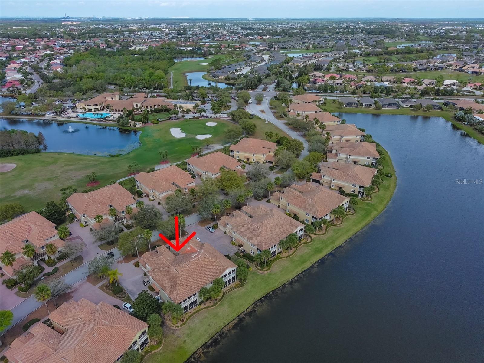 Aerial water view of condo and Renaissance Golf and Country Club.  You are literally a 2 minute walk from the club.