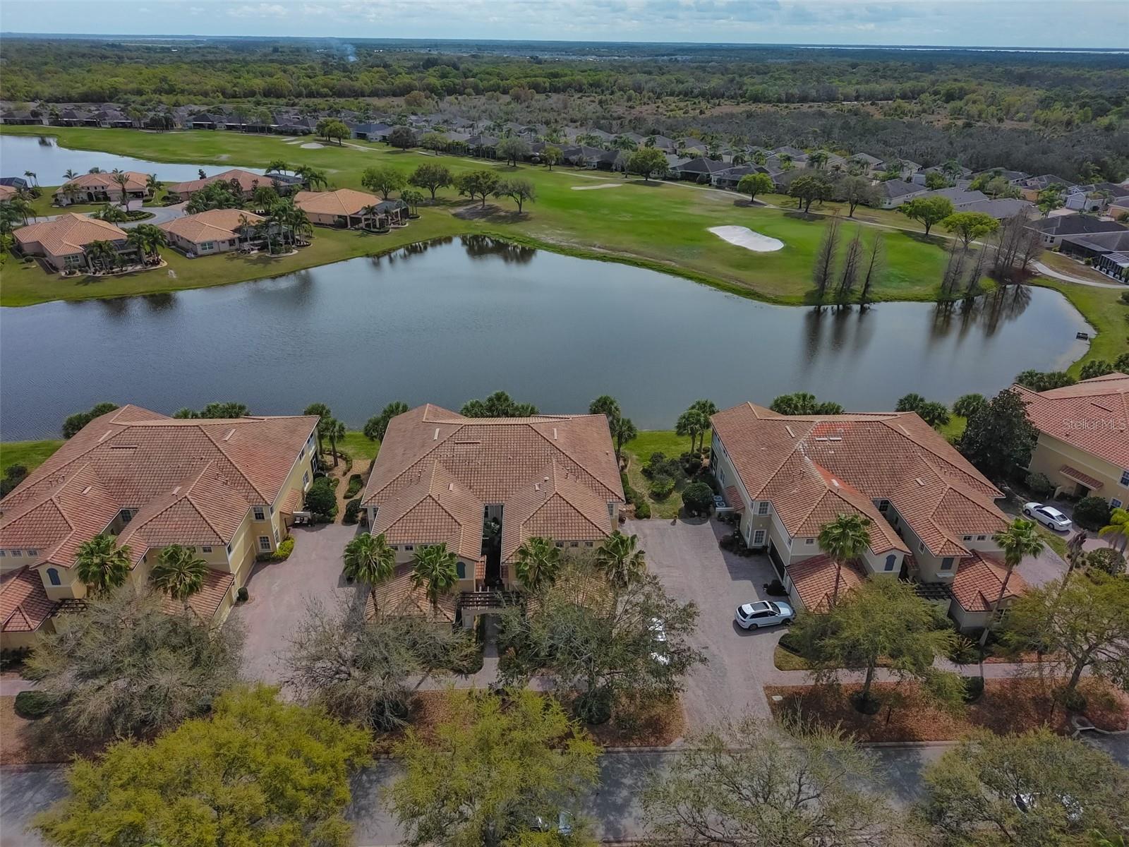 Ariel view of condo on the water with the golf course.