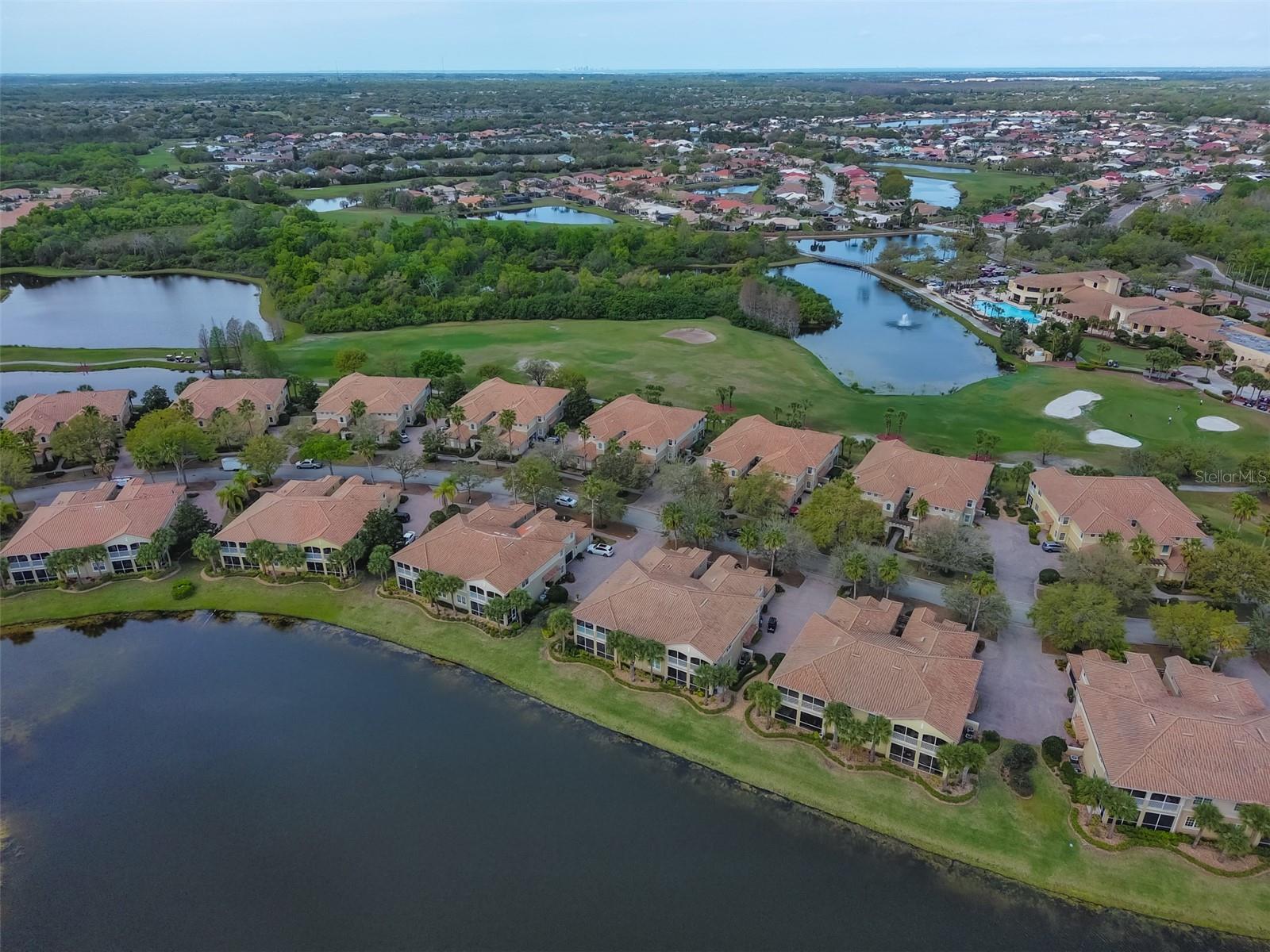 Aerial water and golf course view of condo and Renaissance Golf and Country Club.