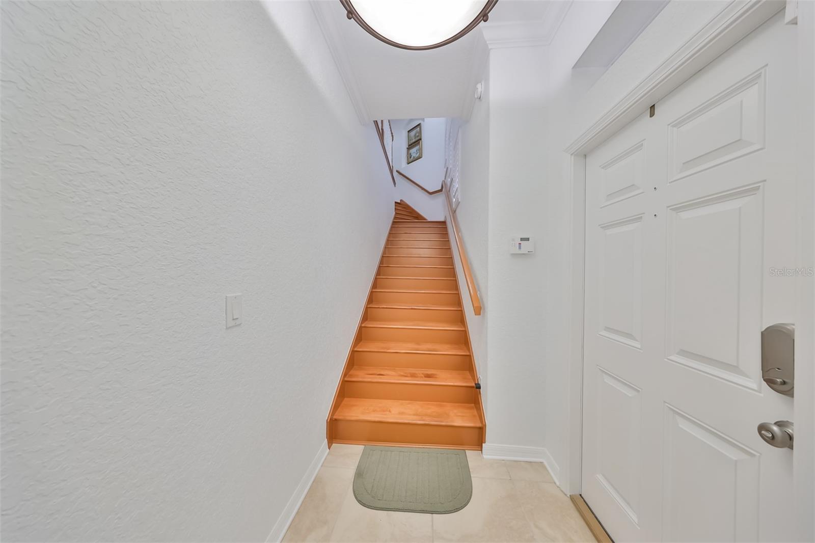 Stunning and bright entrance with all matching wood stairs and handrail lead you into this gorgeous upstairs unit. Either take the stairs or use your own private elevator!