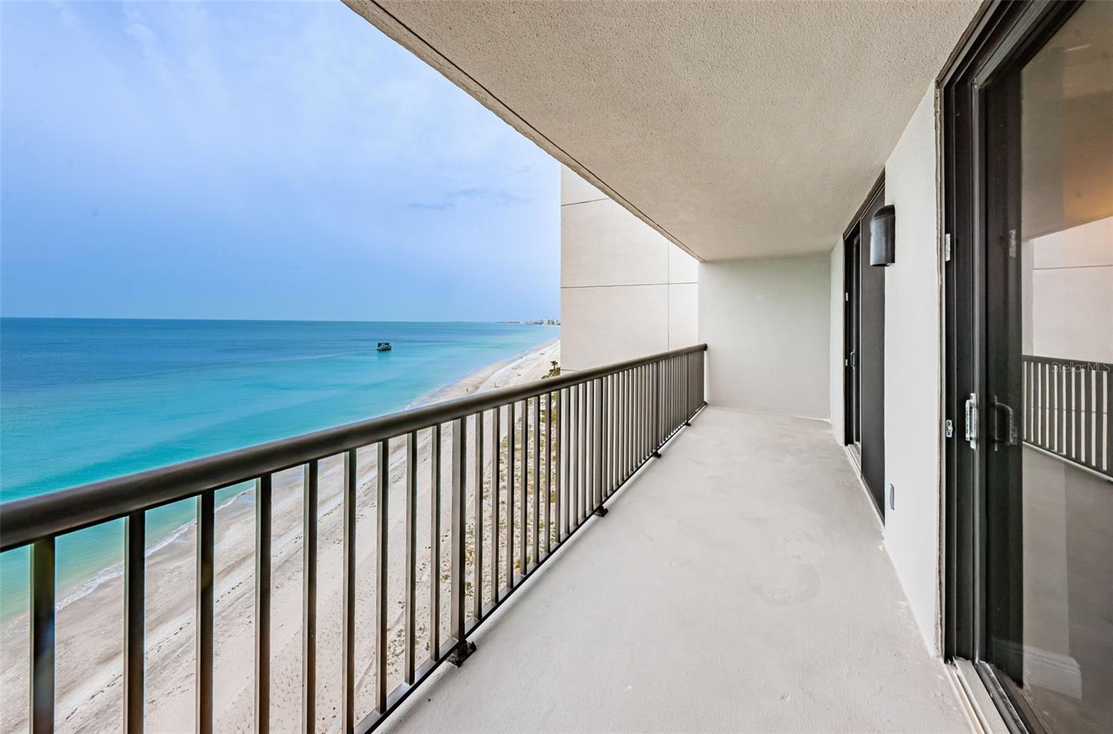 Step out of the Kitchen onto the Direct Gulf front Balcony!