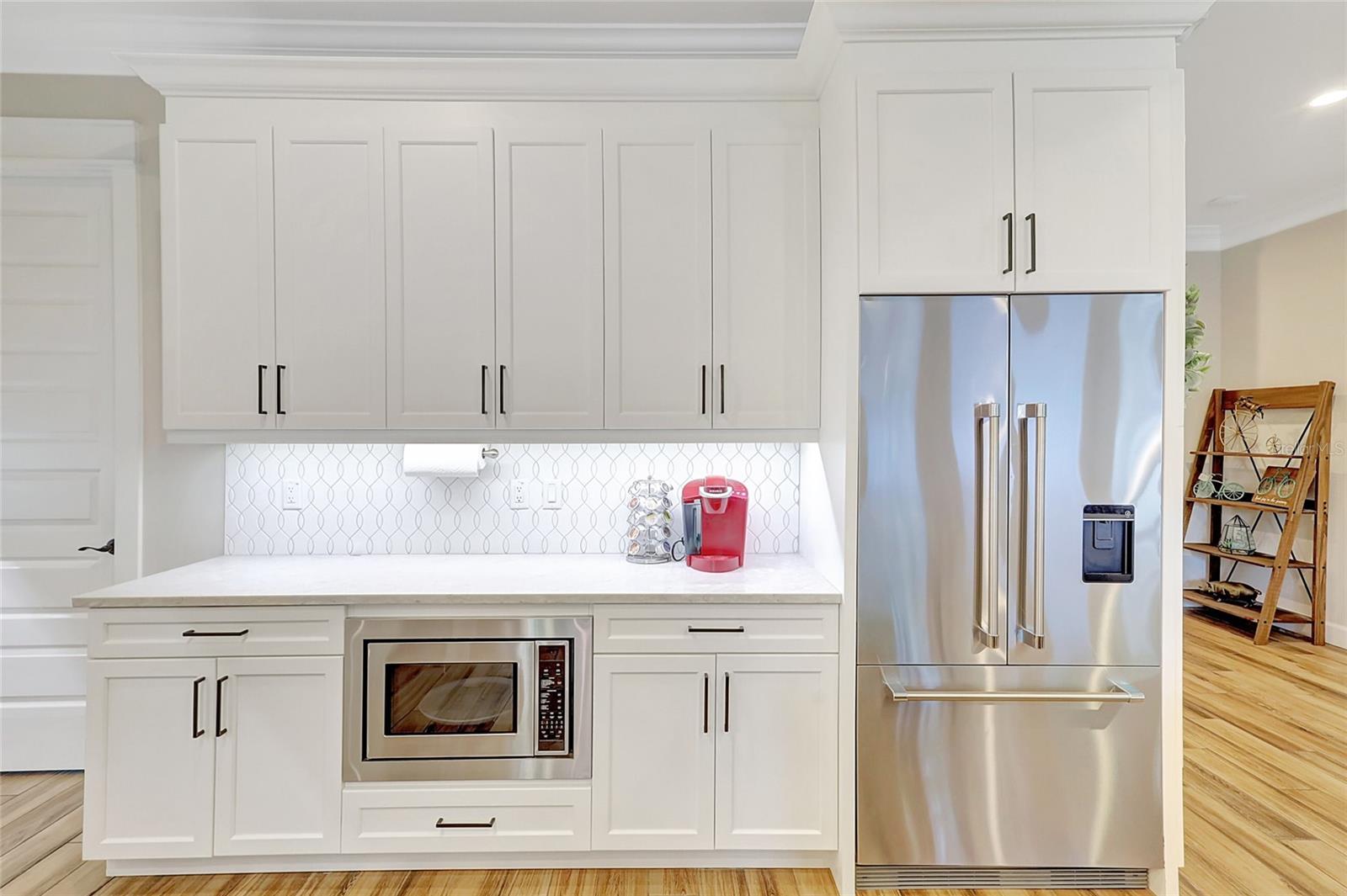Undercabinet lighting, crown moldings and Fisher Paykel appliances.