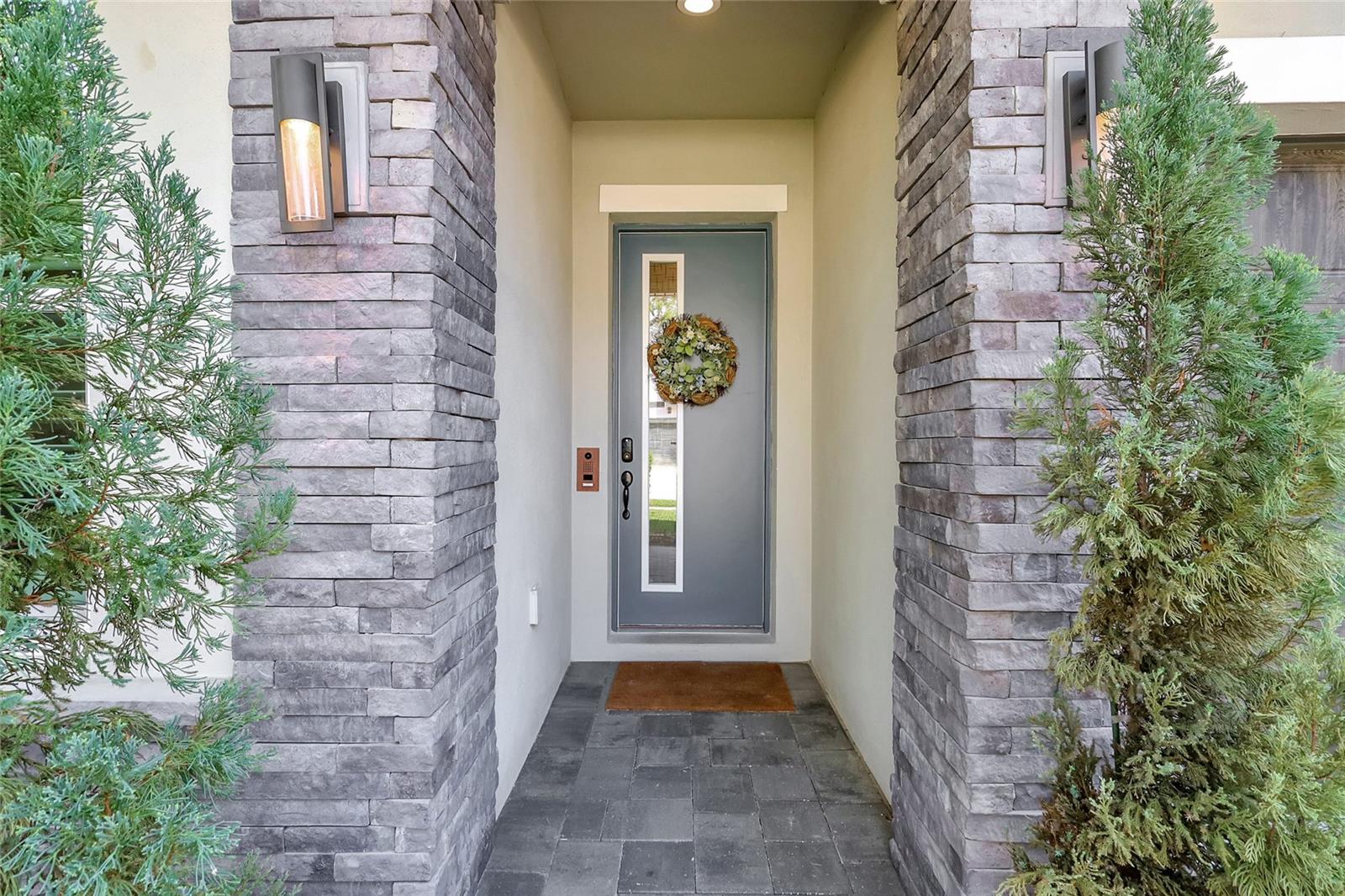 Stack Stone entry way with built in door camera and electronic lock