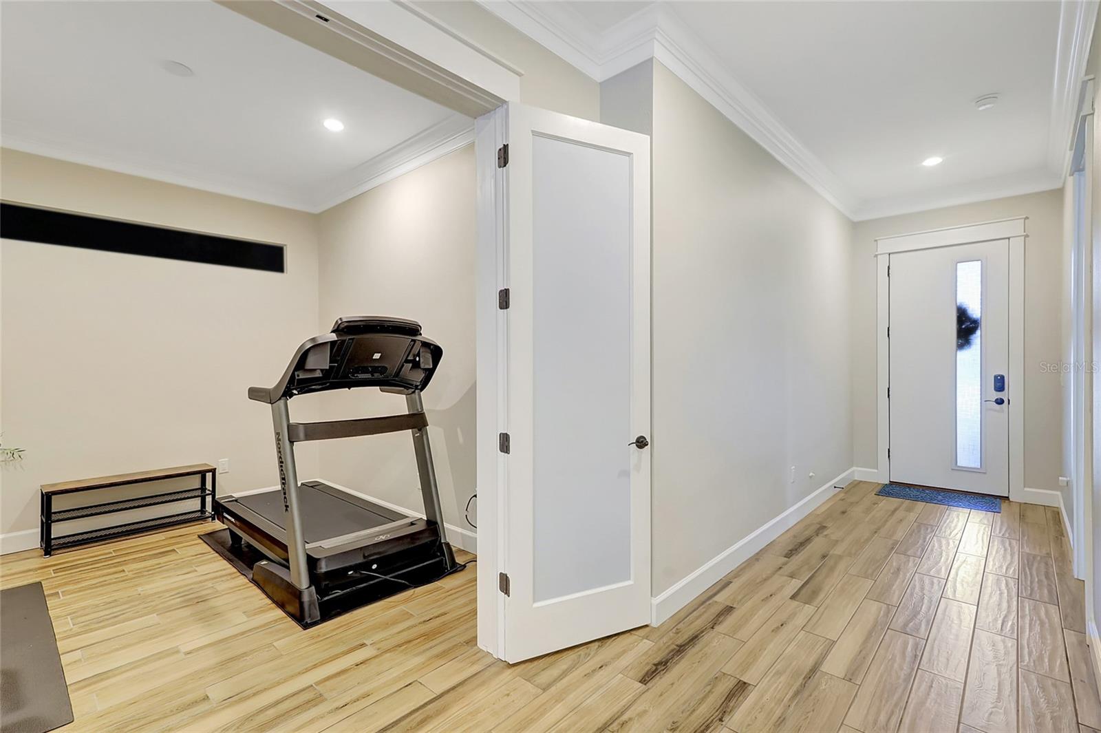 Office or home gym with opaque glass double doors