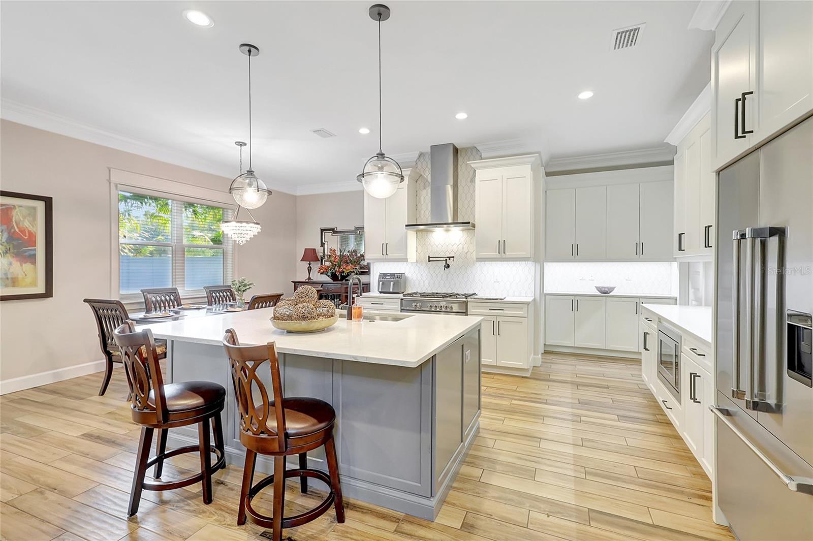 Gathering place kitchen features Fisher Paykel Appliances, walk in Pantry, butlers pantry and separate mud room.