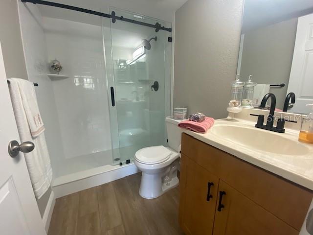 This bathroom shower is completely new! Gorgeous glass doors, new white subway tiles, and new shower and bathroom fixtures. New toilet, new light and sink faucet, and new door handles.. All freshly painted and new floors